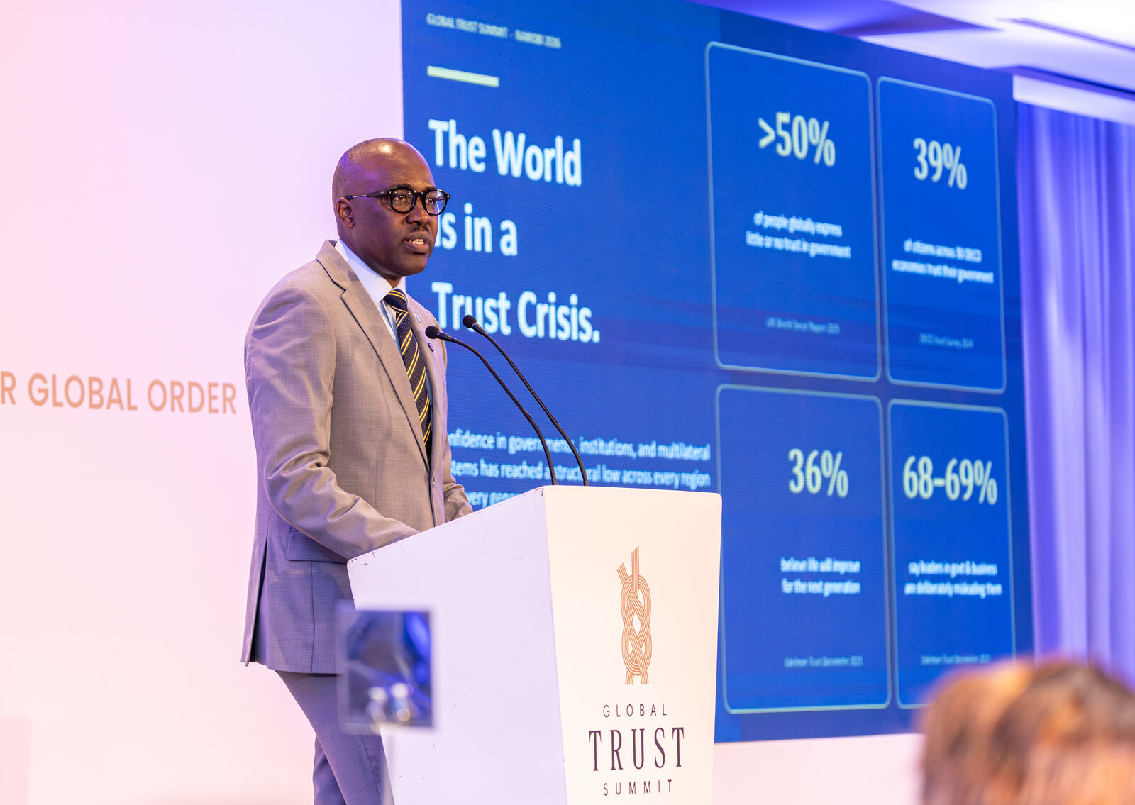 A speaker presents trust research at the Global Trust Summit launch